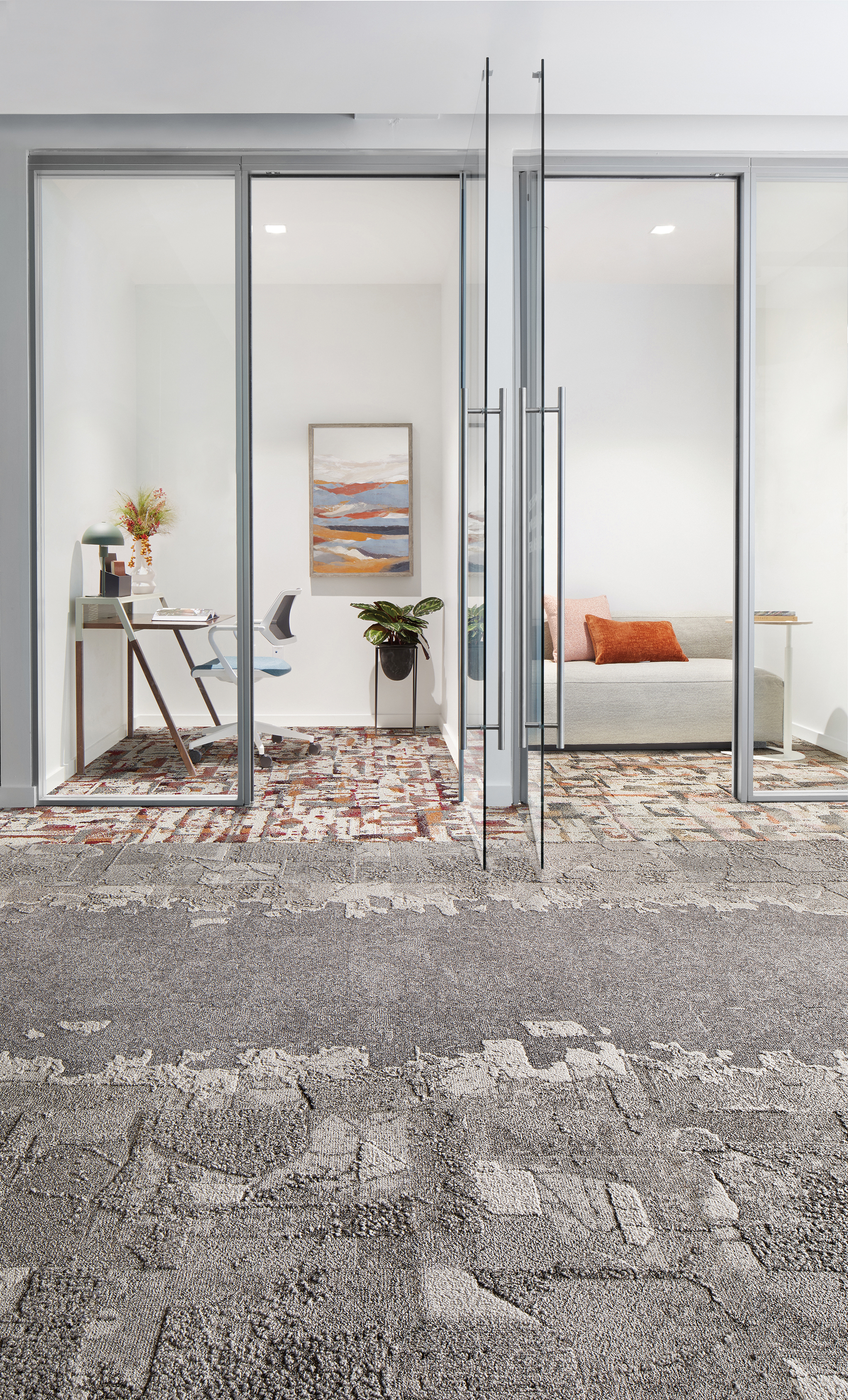 Interface Bridge Creek, Mountain Rock, Flat Rock and Panola Mountain carpet tile in office with glass-enclosed meeting spaces