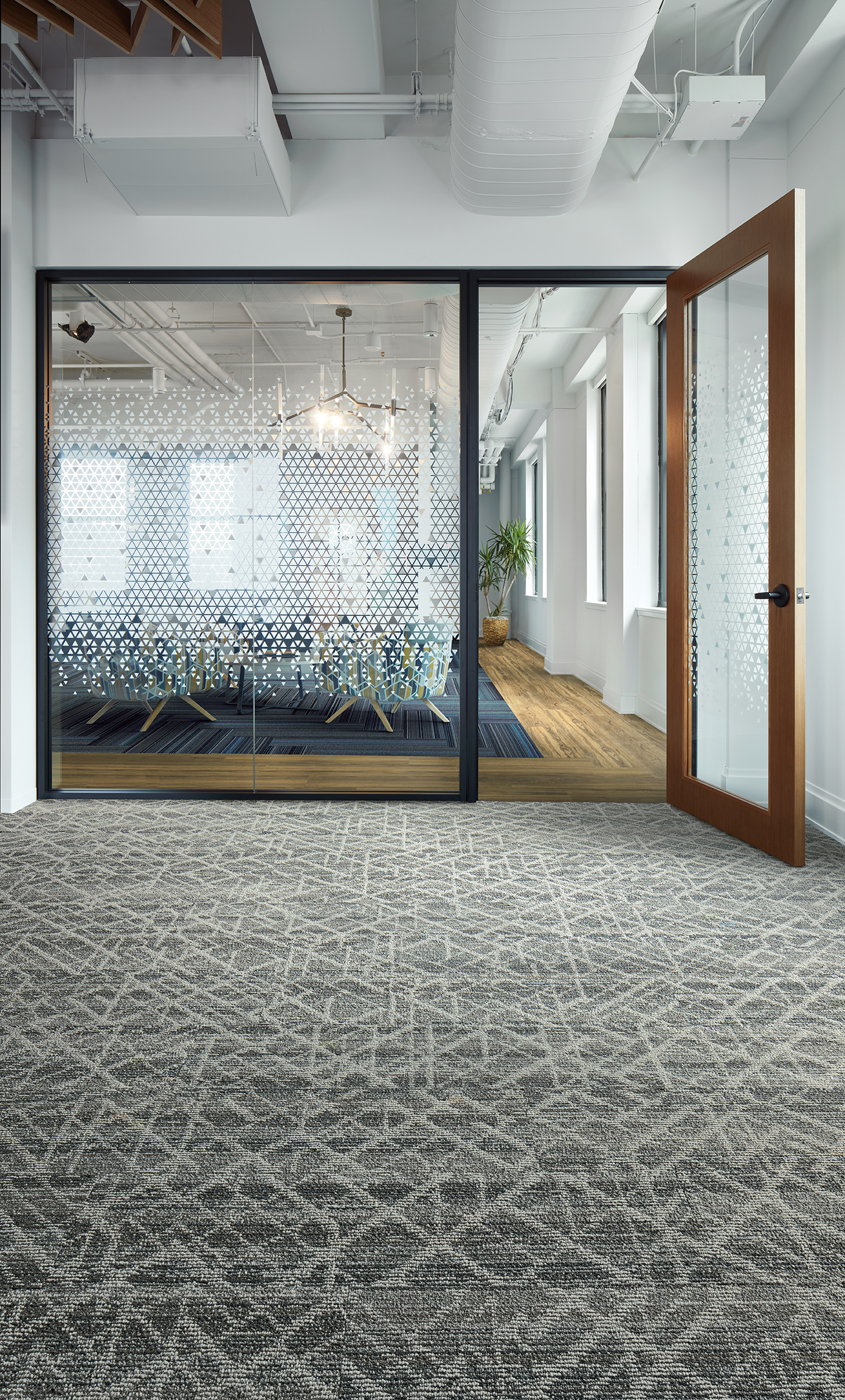 Interface Aglow and Glisten plank carpet tile with Natural Woodgrains LVT in modern office